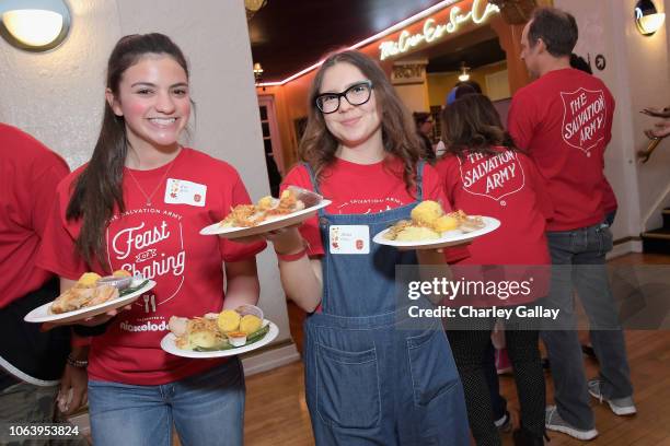 Eva Bella and Alina Foley attend Salvation Army NICKELODEON Feast of Sharing on November 20, 2018 in Los Angeles, California.