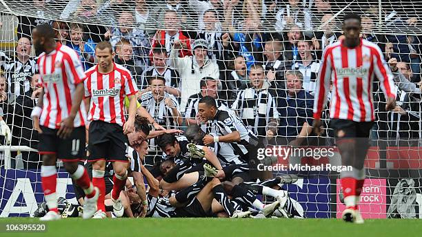 Newcastle players celebrate the first goal by Kevin Nolan during the Barclays Premier League match between Newcastle United and Sunderland at St...