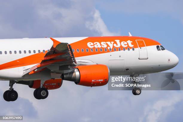 EasyJet Airbus A320-200 with registration G-EZUS seen landing at the Amsterdam Schiphol Airport in Netherlands.