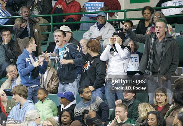 Protestors shout while U.S. President Barack Obama and U.S. Vice President Joe Biden speak during the president's 'Moving America Forward' rally...