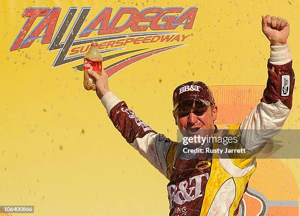 Clint Bowyer, driver of the BB&T Chevrolet, celebrates in a Victory Lane after winning the NASCAR Sprint Cup Series AMP Energy Juice 500 at Talladega...