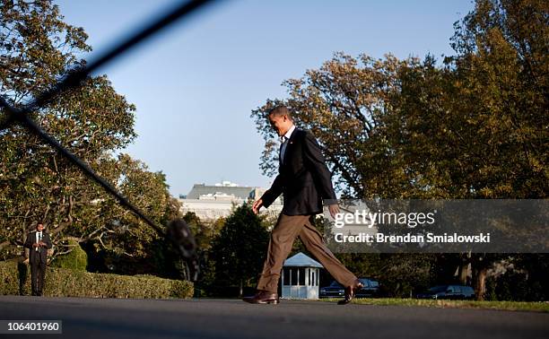 President Barack Obama walks from Marine One on the South Lawn of the White House October 31, 2010 in Washington, DC. President Barack Obama returned...