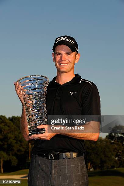 Brendan Steele poses with the champion's trophy after winning in a four hole play-off during the final round of the Nationwide Tour Championship at...