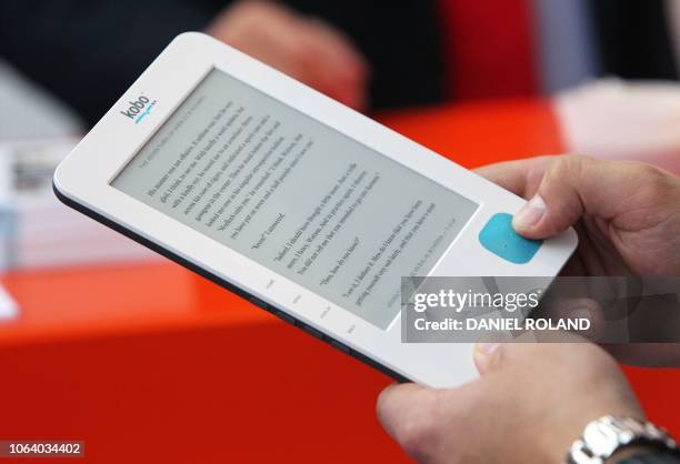 Visitor holds a Kobo ebook reader in his hands in his hands during the 62nd International Book Fair in Frankfurt am Main, on October 6, 2010....