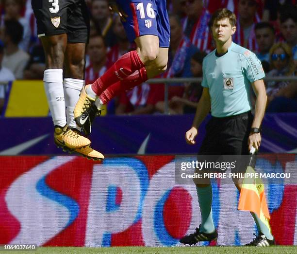 In this file picture Spanish linier and surgeon, Cesar Noval Font, referees the Spanish league football match Club Atletico de Madrid vs Sevilla FC...