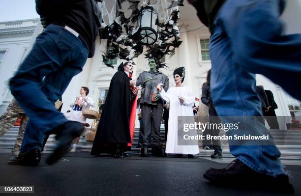 Performers wait to hand out goody bags to trick or treaters at the White House October 31, 2010 in Washington, DC. President Obama and first lady...