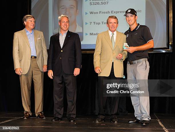 Kevin Chappell receives his PGA TOUR money clip from PGA TOUR Commissioner Tim Finchem along with Bill Calfee and Jim Lyski of Nationwide after the...