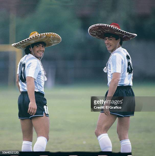 Diego Maradona and Daniel Passarella of Argentina pose with a sombrero ahead of the 1986 FIFA World Cup at Club America training camp on May, 1986 in...