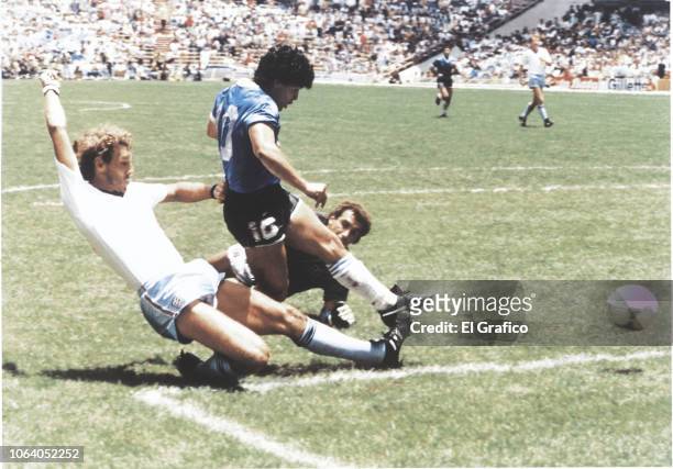 Diego Maradona of Argentina kicks the ball to score the second goal of his team during a 1986 FIFA World Cup Quarter Final match between Argentina...