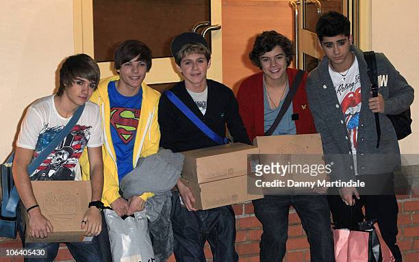 Factor's boy band One Direction are seen at the 'X Factor' studio for the live filming of the show on October 31, 2010 in London, England.