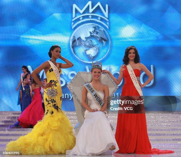 Emma Wareus of Botswana, Alexandria Mills of the United States and Adriana Vasini of Venezuela pose during the 60th Miss World Beauty Pageant at the...