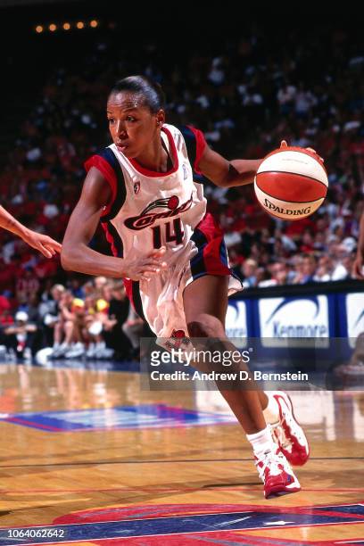 Cynthia Cooper of the Houston Comets dribbles during Game Three of the 1998 WNBA Finals on September 1, 1998 at the Compaq Center in Houston, Texas....