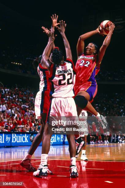 Jennifer Gillom of the Phoenix Mercury shoots during Game Two of the 1998 WNBA Finals on August 29, 1998 at the Compaq Center in Houston, Texas. NOTE...