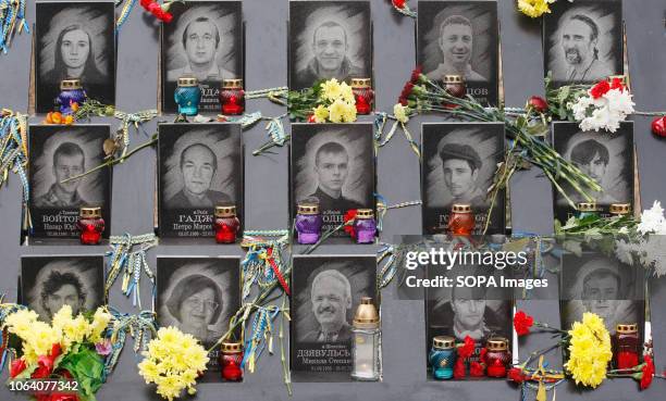 Ukrainians lay flowers at the memorial of the EuroMaidan activists during the 5th anniversary of the Dignity Revolution in Kiev. Euromaidan...