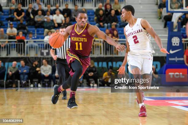 Santa Clara Broncos guard Tahj Eaddy defends against Minnesota Golden Gophers guard Isaiah Washington during the Vancouver Showcase game at Vancouver...