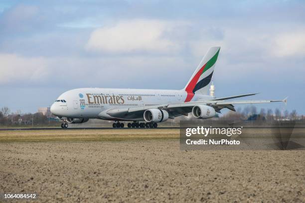 Emirates Airbus A380-800 landing in Amsterdam Schiphol Airport in The Netherlands. The aircraft has the registration A6-EDF and is flying since...