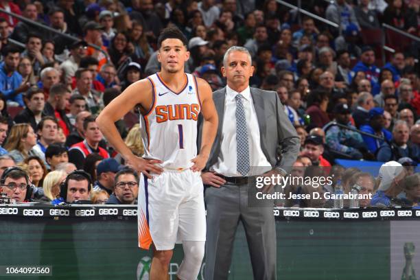 Devin Booker of the Phoenix Suns and Head Coach Igor Kokokov look on against the Philadelphia 76ers on November 19, 2018 at the Wells Fargo Center in...