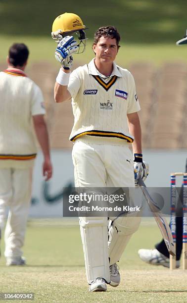 Marcus North of the Warriors celebrates making 100 runs during day four of the Sheffield Shield match between the South Australian Redbacks and the...