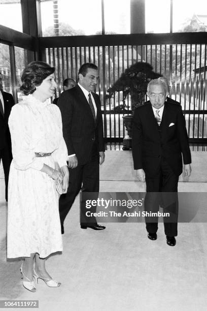 Egyptian President Hosni Mubarak and his wife Suzanne are escorted by Emperor Hirohito prior to their meeting at the Imperial Palace on April 6, 1983...