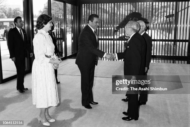 Egyptian President Hosni Mubarak and his wife Suzanne are escorted by Emperor Hirohito prior to their meeting at the Imperial Palace on April 6, 1983...