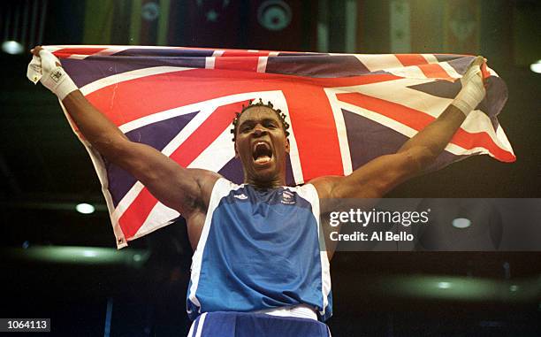 Audley Harrison of Great Britain celebrates winning the boxing gold medal in the + 91 kilogram division held at the Sydney Convention and Exhibition...