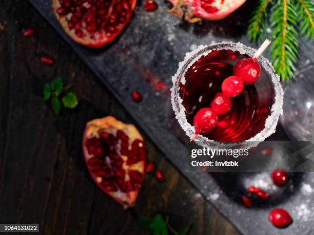 pomegranate cranberry cocktail - cranberry stock pictures, royalty-free photos & images