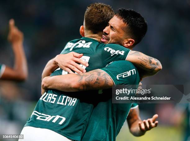 Luan of Palmeiras celebrates with teammate Lucas Lima after scoring the first goal of their team during the match against America MG for the...