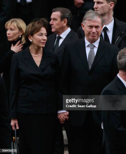 Former German President Horst Koehler and his wife Eva Luise Koehler, followed behind by former German Chancellor Gerhard Schroeder and his wife...