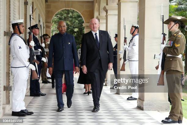 President of India, Ram Nath Kovind, center left, walks with Australia's Governor-General Sir Peter Cosgrove, center right, during a visit to...