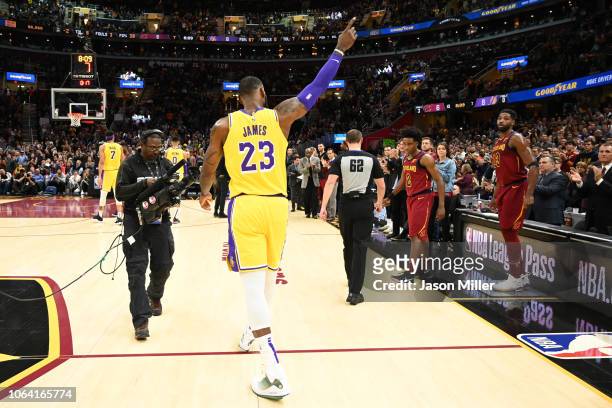 LeBron James of the Los Angeles Lakers recognizes the fans after the Cleveland Cavaliers honored James during a time-out during the first half at...
