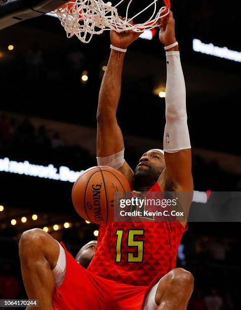 Vince Carter of the Atlanta Hawks dunks and scores his 25,000th NBA point in the final seconds of their 124-108 loss to the Toronto Raptors at State...