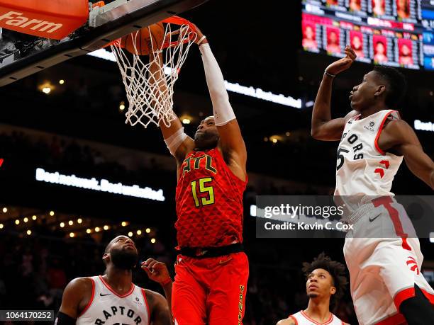 Vince Carter of the Atlanta Hawks dunks and scores his 25,000th NBA point in the final seconds of their 124-108 loss to the Toronto Raptors at State...