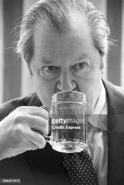 John Spencer, the 8th Earl Spencer , taking a drink on May 17, 1985.