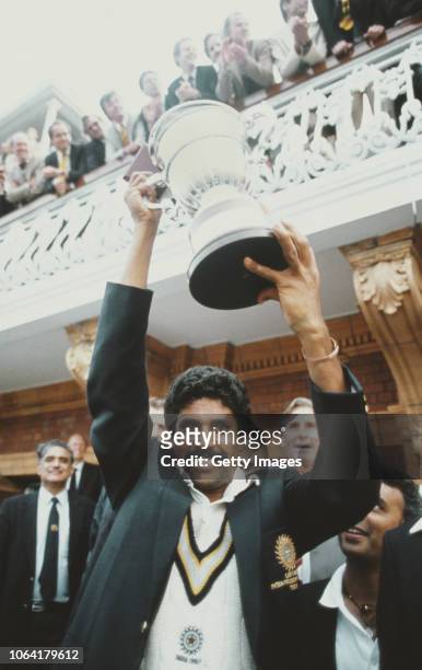 India captain Kapil Dev lifts the trophy on the balcony of the pavillion as Sunil Gavaskar looks on after the 1983 Prudential World Cup Final victory...