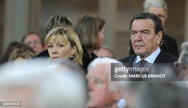 Former German Chancellor Gerhard Schroeder and his wife Doris Schroeder-Koepf attend the funeral service of Hannelore "Loki" Schmidt at the Sankt...