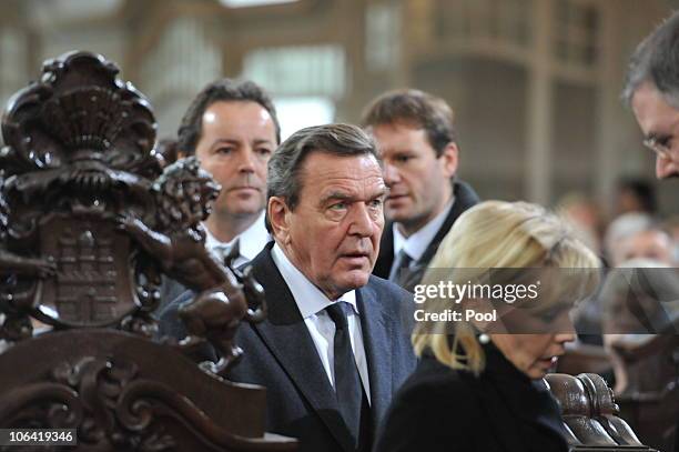 Former German Chancellor Gerhard Schroeder and his wife Doris Schroeder-Koepf attend the memorial service for Loki Schmidt, wife of former German...