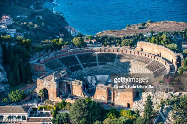 Taormina, Italy Aerial view of the ancient theatre of Taormina. The Ancient Theatre of Taormina is an ancient Greek theatre built in the 3rd century...