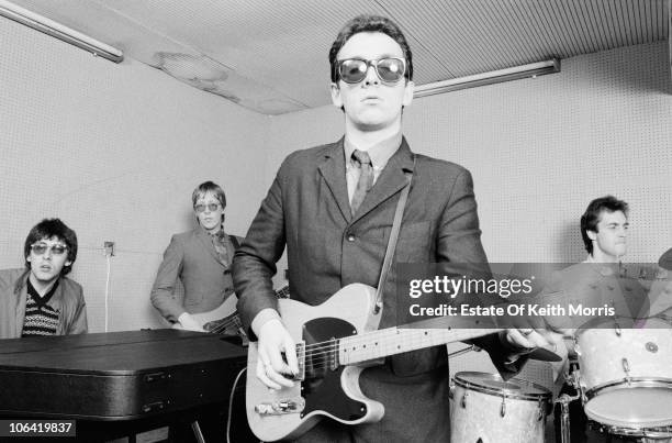 British singer-songwriter Elvis Costello with his backing band The Attractions, UK, 1980. From left to right, keyboard player Steve Nieve, bassist...