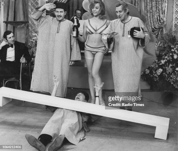 Actors Leon Thau, Clive Dunn , Margaret Nolan and Spike Milligan in the 'Filthistan Trio' sketch from the television show 'The World of Beachcomber',...