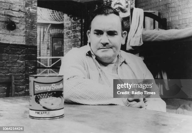 Actor Ronnie Barker staring at a tin of pineapple in a scene from episode 'Just Desserts' of the television sitcom 'Porridge', May 4th 1975.