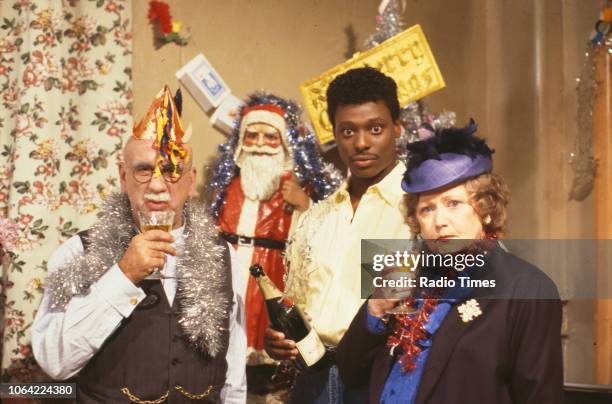 Portrait of actors Warren Mitchell, Eamonn Walker and Carmel McSharry during the filming of the 'Christmas Special' episode of the BBC television...