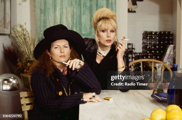 Portrait of actresses Jennifer Saunders and Joanna Lumley smoking cigarettes on the set of the television sitcom 'Absolutely Fabulous', May 21st 1993.