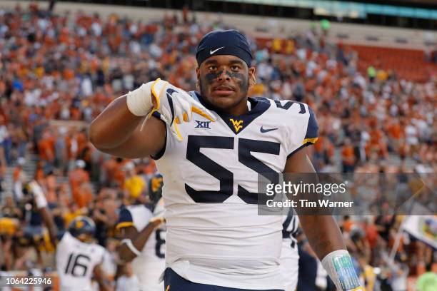 Dante Stills of the West Virginia Mountaineers celebrates with the horns down signal after the game against the Texas Longhorns at Darrell K...