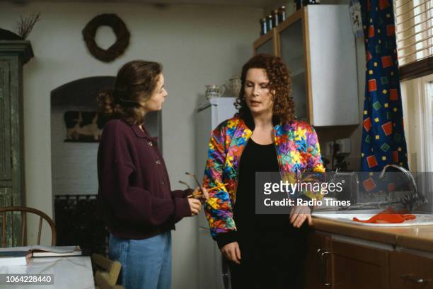 Actresses Julia Sawalha and Jennifer Saunders in a kitchen scene from the BBC television sitcom 'Absolutely Fabulous', February 26th 1992.
