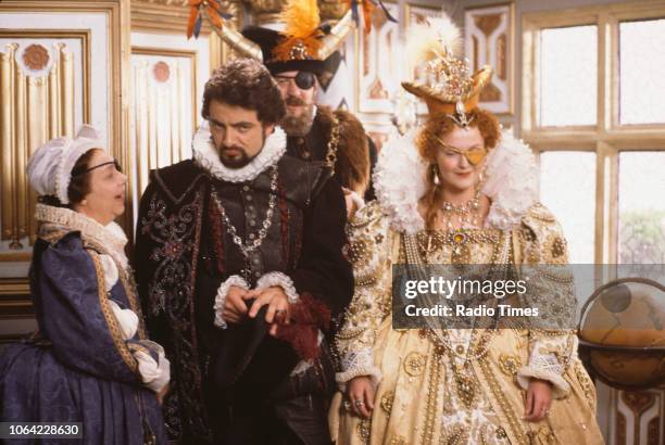 Actors Patsy Byrne, Rowan Atkinson, Stephen Fry and Miranda Richardson in a scene from episode 'Potato' of the BBC television sitcom 'Black Adder...