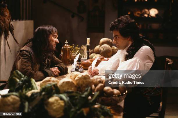 Actors Tony Robinson and Rowan Atkinson in a scene from episode 'Dish and Dishonesty' of the BBC television sitcom 'Black Adder the Third', June 19th...