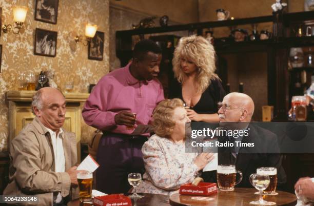 Actors Ken Campbell, Vas Blackwood, Corinne Russell, Carmel McSharry and Warren Mitchell in a pub scene from series 4, episode 4, of the BBC...