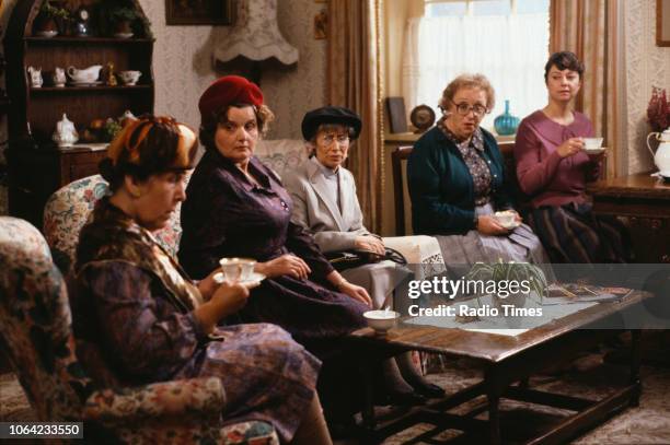 Actresses Kathy Staff, Jane Freeman, Juliette Kaplan, Thora Hird and Sarah Thomas drinking tea in a scene from episode 'Come Back Jack Harry...