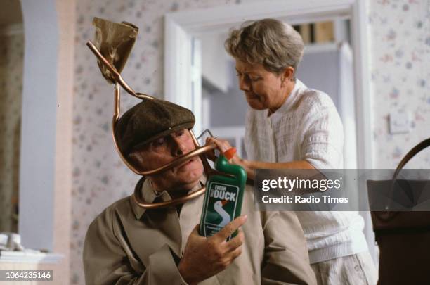 Actors Annette Crosbie and Richard Wilson sitting in a scene from episode 'Dramatic Fever' of the BBC Television sitcom 'One Foot in the Grave',...