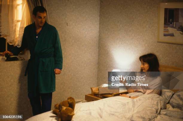 Actors Janine Duvitski and Angus Deayton in a bedroom scene from episode 'Warm Champagne' of the BBC Television sitcom 'One Foot in the Grave',...